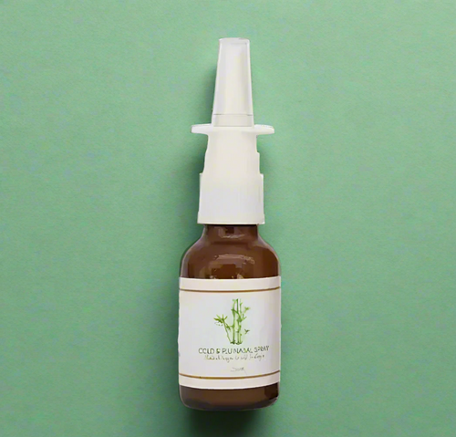Bottle of cold and flu spray with a white label on a white background
