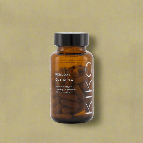 Brown supplement bottle labeled 'Kiko' on a green background