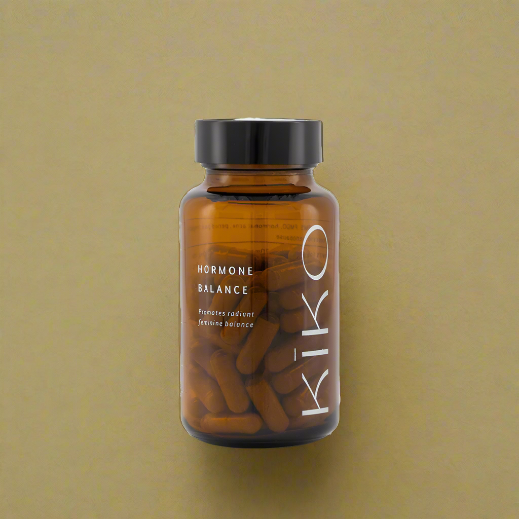 Brown supplement bottle labeled 'Kiko' with 'Hormone Balance' on a transparent background